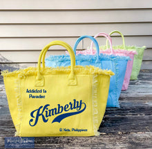 Cargar imagen en el visor de la galería, Personalized canvas tote with fringe in yellow blue pink and green colors by Travellers Hat Boutique