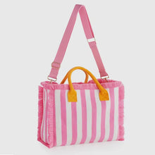 Load image into Gallery viewer, Pink and white striped handbag with fringe edges and yellow handles from Travellers Hat Boutique