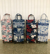 Load image into Gallery viewer, Four colorful travel luggage cover with name options featuring floral and tropical prints from Travellers Hat Boutique