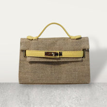 Load image into Gallery viewer, Wholesale jute clutch bags with yellow leather handle and clasp by Travellers Hat Boutique
