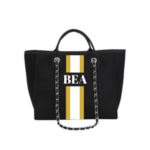Load image into Gallery viewer, Black custom monogram tote bag with gold and white vertical stripes and BEA initials