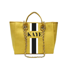 Load image into Gallery viewer, Yellow custom monogram tote bag with black and white stripe and gold chain handles from Travellers Hat Boutique