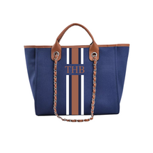 Load image into Gallery viewer, Custom monogram tote bag in navy blue with brown and white stripes and leather handles by Travellers Hat Boutique
