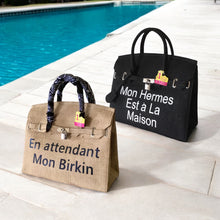 Load image into Gallery viewer, Travellers Hat Boutique 35cm printed burlap bag in natural and black with French text and patterned handles
