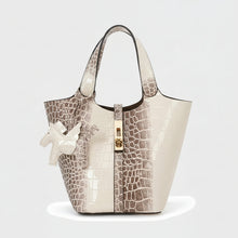 Carregar imagem no visualizador da galeria, Croc Luxe handbag with crocodile embossed pattern on a white background
