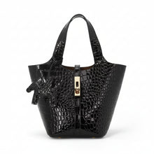 Carregar imagem no visualizador da galeria, Black crocodile-embossed handbag with gold zipper on a white background

