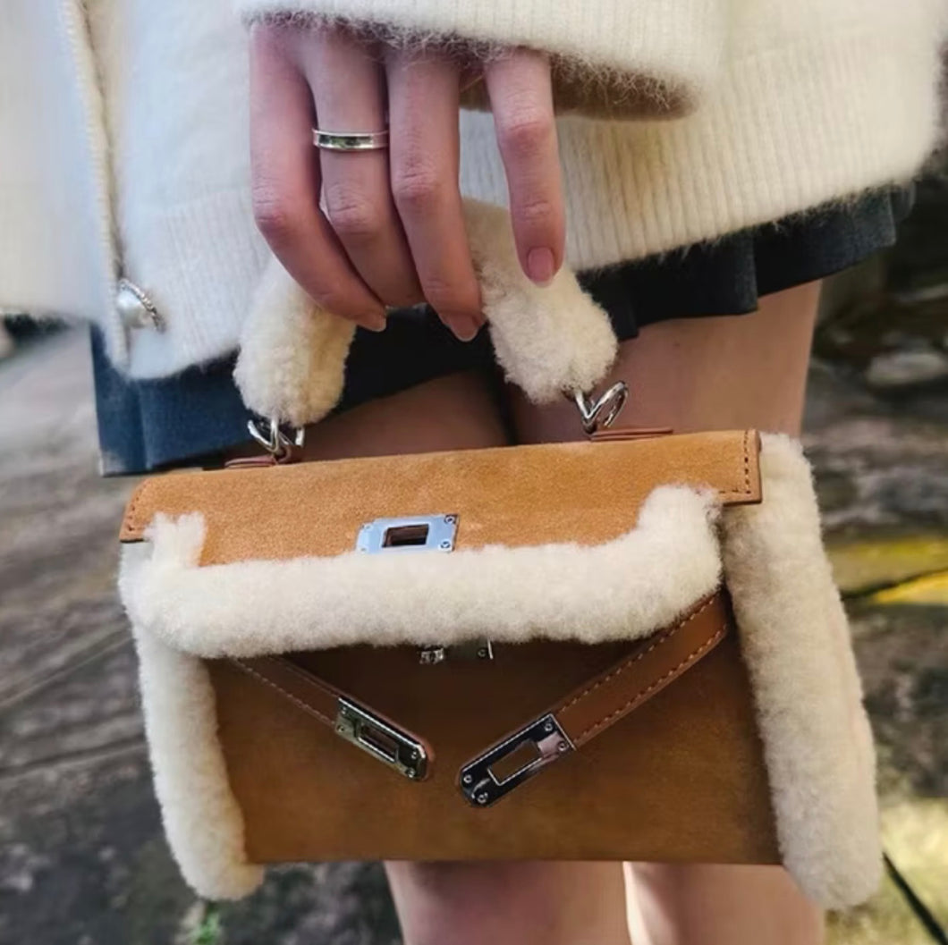 Suede kelly clutch