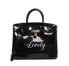 Carregar imagem no visualizador da galeria, Personalized Beachkin tote black glossy bag with Lovely text and gold lock by Travellers Hat Boutique
