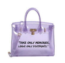 Carregar imagem no visualizador da galeria, Transparent purple personalized Beachkin tote bag with gold lock and quote Take only memories leave only footprints
