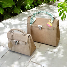 Cargar imagen en el visor de la galería, Eco friendly kelly style tote bags in natural fabric with silver lock detail from Travellers Hat Boutique
