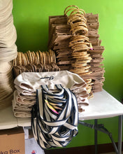 Lataa kuva Galleria-katseluun, Stack of canvas embroidered boat tote bag with striped handles on a white table at Travellers Hat Boutique
