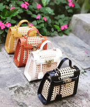 Load image into Gallery viewer, Collection of genuine leather solihiya bags in black white brown and mustard colors displayed outdoors
