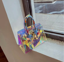 Carregar imagem no visualizador da galeria, Holographic clear tote bag with colorful iridescent finish and floral wrapped handles by Travellers Hat Boutique
