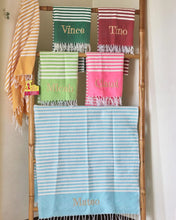 Load image into Gallery viewer, Colorful personalized beach towel collection with names embroidered in various colors and striped designs
