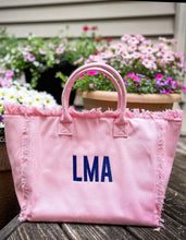 Lade das Bild in den Galerie-Viewer, Pink personalized canvas tote with fringe featuring blue LMA monogram from Travellers Hat Boutique
