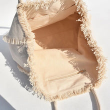 Lade das Bild in den Galerie-Viewer, Inside view of personalized canvas tote with fringe showing spacious interior and inner zipper pocket
