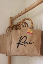 Lataa kuva Galleria-katseluun, Personalized eco friendly tote bag with bamboo handles and custom name Rai from Travellers Hat Boutique
