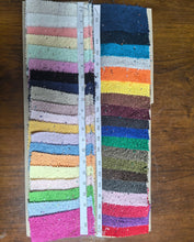 Cargar imagen en el visor de la galería, Colorful fabric swatches for a Terry cloth handbag from Travellers Hat Boutique in various vibrant shades
