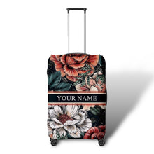 Load image into Gallery viewer, Travel luggage cover with name featuring large floral design in red white and green on black background
