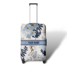 Load image into Gallery viewer, Travel luggage cover with name in blue floral design by Travellers Hat Boutique on suitcase
