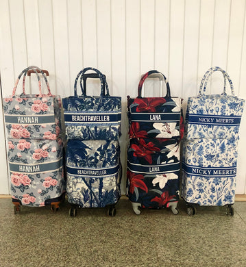 Four colorful travel luggage cover with name options featuring floral and tropical prints from Travellers Hat Boutique