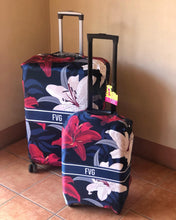 Load image into Gallery viewer, Travel luggage cover with name FVG in floral design protecting two suitcases with handles
