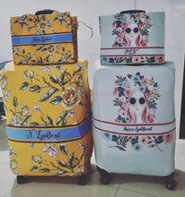 Load image into Gallery viewer, Travel luggage cover with name in floral and artistic designs on two suitcases from Travellers Hat Boutique

