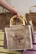 Lataa kuva Galleria-katseluun, Personalized eco friendly tote bag with bamboo handles and custom name embroidery by Travellers Hat Boutique
