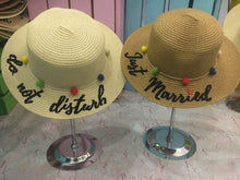 Carregar imagem no visualizador da galeria, Custom embroidered round hat by Travellers Hat Boutique featuring colorful pom-poms and phrases do not disturb and just married
