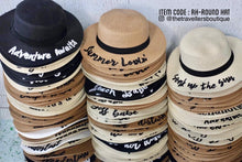 Carregar imagem no visualizador da galeria, Stack of custom embroidered round hats in black, beige, and white colors with various text designs
