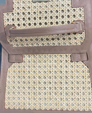 Load image into Gallery viewer, Close-up of genuine leather solihiya bag tote with woven rattan and brown leather trim from Travellers Hat Boutique
