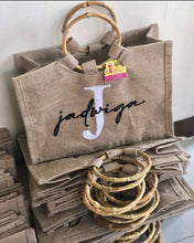 Load image into Gallery viewer, Jadaviga tote bag with bamboo handles made from natural jute fabric by Travellers Hat Boutique
