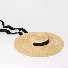 Lade das Bild in den Galerie-Viewer, Large wheat straw hat with wide brim and black ribbon tie by Travellers Hat Boutique
