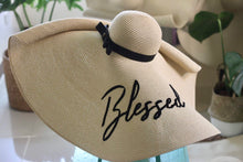 Lade das Bild in den Galerie-Viewer, Oversized straw sun hat with black ribbon and Blessed embroidery by Travellers Hat Boutique
