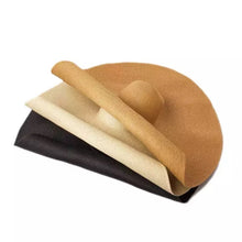 Lade das Bild in den Galerie-Viewer, Stack of oversized straw sun hat in tan beige and black from Travellers Hat Boutique
