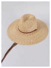Carregar imagem no visualizador da galeria, Travellers Hat Boutique panama wheat hat with wide brim and brown chin strap
