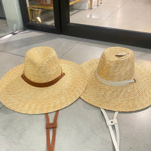 Carregar imagem no visualizador da galeria, Two panama wheat hats with wide brims and chin straps in brown and white from Travellers Hat Boutique
