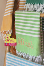 Load image into Gallery viewer, Green and white striped personalized beach towel with fringed edges and the name Micah embroidered

