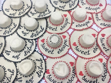 Lade das Bild in den Galerie-Viewer, Custom floppy hat with pompoms in white featuring sweet escape and do not disturb text designs
