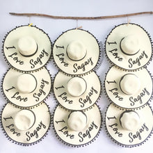 Lade das Bild in den Galerie-Viewer, Custom floppy hat with pompoms in cream color displaying I Love Sagay text by Travellers Hat Boutique

