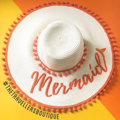 White custom floppy hat with pompoms and orange Mermaid embroidery from Travellers Hat Boutique