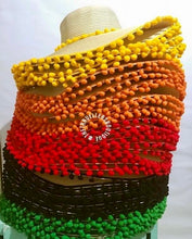 Lade das Bild in den Galerie-Viewer, Stack of custom floppy hat with pompoms in yellow orange red black and green colors from Travellers Hat Boutique
