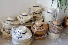 Load image into Gallery viewer, Wholesale floppy sun hats in various neutral colors wrapped in plastic from Travellers Hat Boutique
