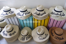 Load image into Gallery viewer, Wholesale floppy sun hats with black bands and embroidered beach-themed phrases from Travellers Hat Boutique
