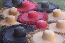 Lade das Bild in den Galerie-Viewer, Colorful collection of fringe sun hat for women with wide brims displayed on grass
