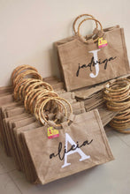 Load image into Gallery viewer, Travellers Hat Boutique personalized jute totes with bamboo handles featuring names Jadwiga and Alicia
