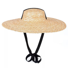 Lade das Bild in den Galerie-Viewer, Wide brim wheat straw hat with ribbon ties perfect for sun protection and travel
