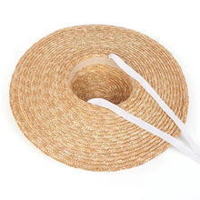 Lade das Bild in den Galerie-Viewer, Wheat straw hat with ribbon in natural color featuring a wide brim for sun protection
